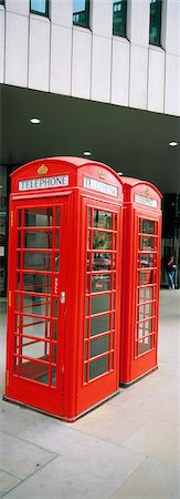 red architecture - Two red telephone booths in front of building Stock Photo - Premium Royalty-Free, Code: 6102-03858955