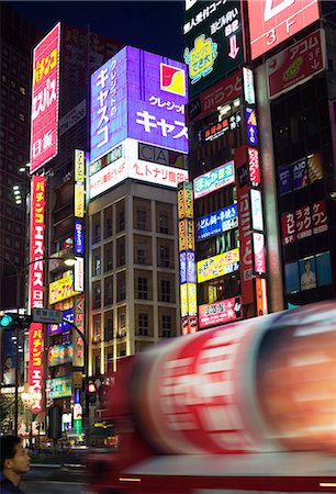 Illuminated buildings with neon signs in city at night Stock Photo - Premium Royalty-Free, Code: 6102-03859420