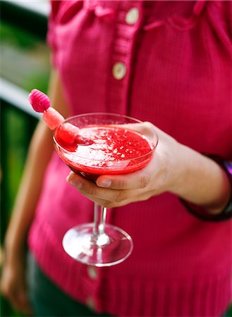 red cocktail - A woman holding a drink, Sweden. Stock Photo - Premium Royalty-Free, Code: 6102-03865798