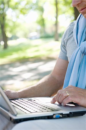 A man using his laptop outdoors, Stockholm, Sweden. Stock Photo - Premium Royalty-Free, Code: 6102-03865998