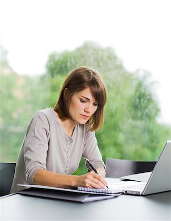 student computer writing - A woman using a laptop, Sweden. Stock Photo - Premium Royalty-Free, Code: 6102-03866076