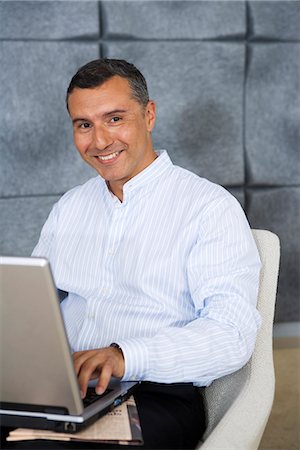 simsearch:6102-03859327,k - A man at a computer in an office, Sweden. Stock Photo - Premium Royalty-Free, Code: 6102-03866146