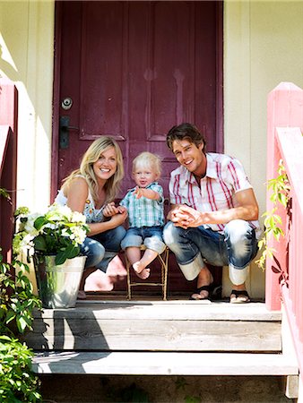 A family in front of a house, Stockholm, Sweden. Stock Photo - Premium Royalty-Free, Code: 6102-03866180