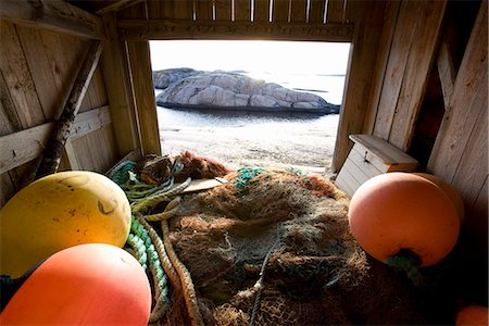 A fishing-net in a boathouse, Bohuslan, Sweden. Stock Photo - Premium Royalty-Free, Code: 6102-03866360