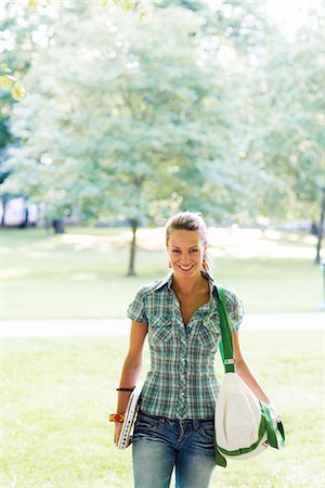 A young woman with a laptop in a park, Sweden. Stock Photo - Premium Royalty-Free, Code: 6102-03866389