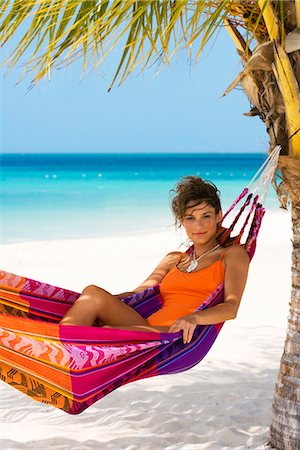 A woman in a hammock, Aruba. Stock Photo - Premium Royalty-Free, Code: 6102-03866403