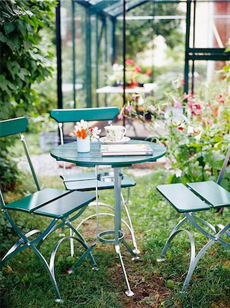 patio furniture - Chairs and a table in a patio, Sweden. Stock Photo - Premium Royalty-Free, Code: 6102-03866625