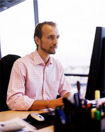 simsearch:6102-03859327,k - A man in an office, Sweden. Stock Photo - Premium Royalty-Free, Code: 6102-03866733