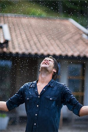 A man enjoying the rain, Sweden. Stock Photo - Premium Royalty-Free, Code: 6102-03866840