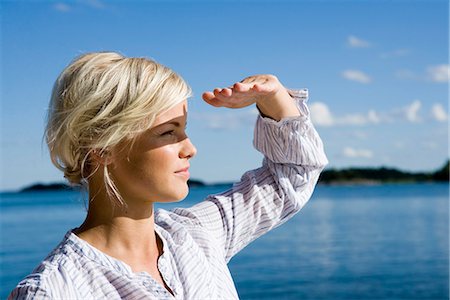 A woman by the sea in the archipelago of Stockholm, Sweden. Stock Photo - Premium Royalty-Free, Code: 6102-03866851