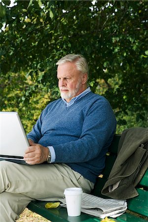 photos of old men on bench - A man using a laptop in a park, Sweden. Stock Photo - Premium Royalty-Free, Code: 6102-03867093