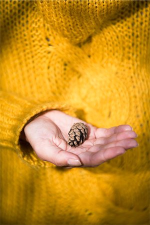 pinecones - A woman holding a pine cone, Sweden. Stock Photo - Premium Royalty-Free, Code: 6102-03867022