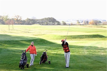 senior couple golf - An elderly couple playing golf, Skane Sweden. Stock Photo - Premium Royalty-Free, Code: 6102-03867275