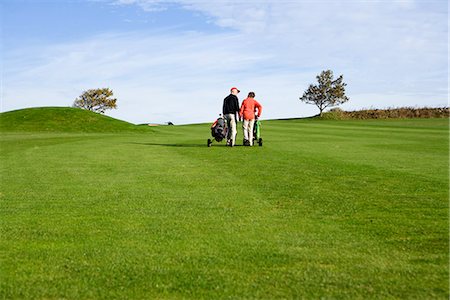 An elderly couple playing golf, Skane Sweden. Foto de stock - Sin royalties Premium, Código: 6102-03867284