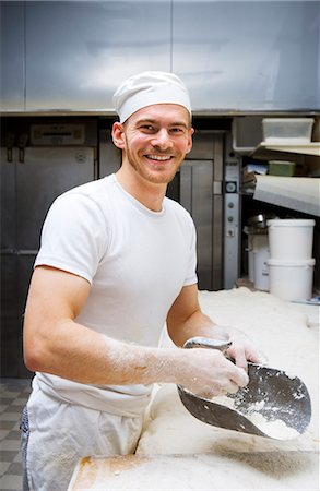 friendly - A smiling baker in a bakery, Sweden. Stock Photo - Premium Royalty-Free, Code: 6102-03867375