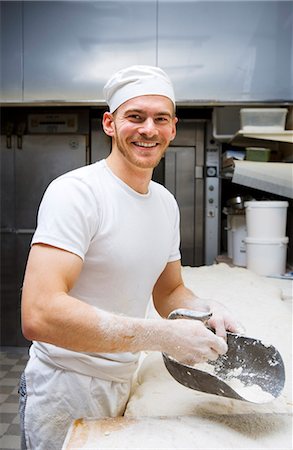 friendly young man - A smiling baker in a bakery, Sweden. Stock Photo - Premium Royalty-Free, Code: 6102-03867375