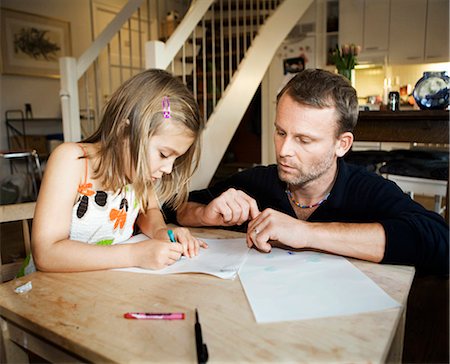 Father and daughter painting together, Sweden. Stock Photo - Premium Royalty-Free, Code: 6102-03867395