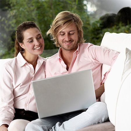 Young couple using a laptop, Sweden. Stock Photo - Premium Royalty-Free, Code: 6102-03867553