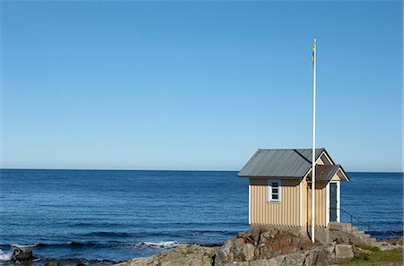 small house on horizon - A small house by the ocean, Skane, Sweden. Stock Photo - Premium Royalty-Free, Code: 6102-03867664