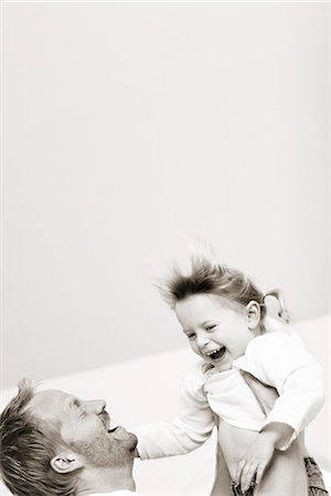 Father playing with his daughter. Stock Photo - Premium Royalty-Free, Code: 6102-03867673