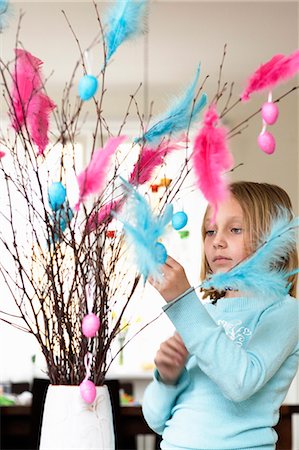 designer of interior decoration - A girl putting easter decorations on a bouquet of twigs. Stock Photo - Premium Royalty-Free, Code: 6102-03826847
