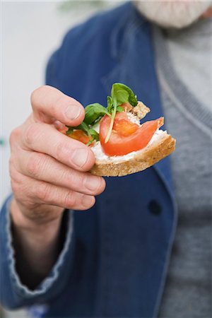 Sandwich with tomato and basil, Sweden. Stock Photo - Premium Royalty-Free, Code: 6102-03827050