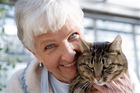 senior with cat - An elderly scandinavian woman and a cat, Sweden. Stock Photo - Premium Royalty-Free, Code: 6102-03827030