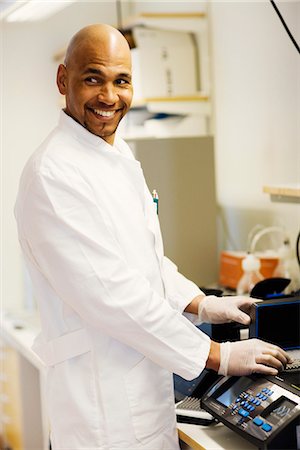 A smiling male researcher in a laboratory, Sweden. Stock Photo - Premium Royalty-Free, Code: 6102-03827305