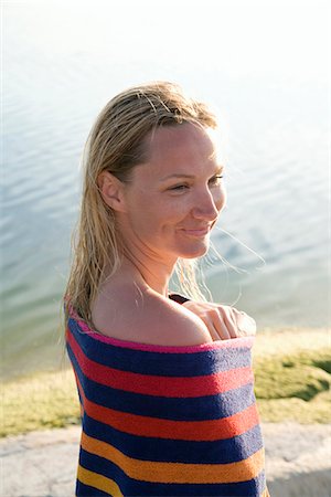simsearch:6102-03750096,k - A woman wit a towel wrapped around herself, Ostergotland, Sweden. Stock Photo - Premium Royalty-Free, Code: 6102-03827600