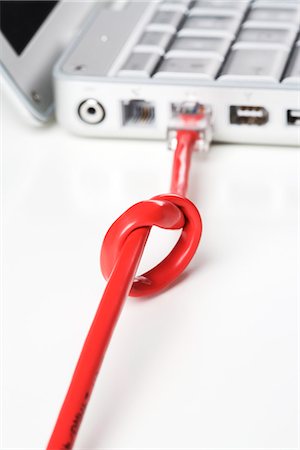 A knot on a flex to a portable computer, close-up. Foto de stock - Sin royalties Premium, Código: 6102-03827794