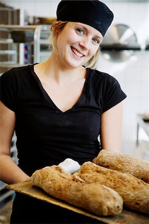 front of a bakery store - Portrait of a female baker, Sweden. Stock Photo - Premium Royalty-Free, Code: 6102-03827705