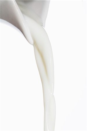 scorrere - Milk being poured into a glass. Fotografie stock - Premium Royalty-Free, Codice: 6102-03827871
