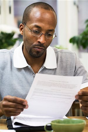 simsearch:6102-04929446,k - A man paying the bills, Sweden. Stock Photo - Premium Royalty-Free, Code: 6102-03827914