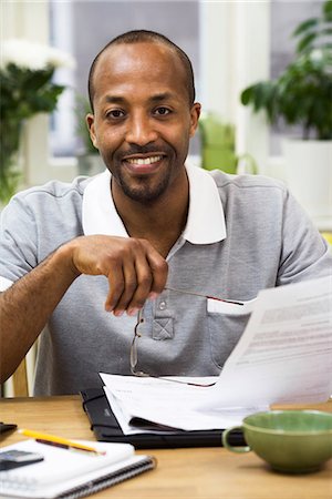 simsearch:6102-04929446,k - A man paying the bills, Sweden. Stock Photo - Premium Royalty-Free, Code: 6102-03827918