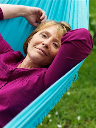 Portrait of a woman in a hammock, Sweden. Stock Photo - Premium Royalty-Free, Code: 6102-03828050