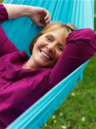 Portrait of a woman in a hammock, Sweden. Stock Photo - Premium Royalty-Free, Code: 6102-03828051