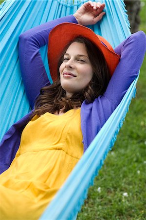 Portrait of a Scandinavian woman in a hammock. Stock Photo - Premium Royalty-Free, Code: 6102-03828070