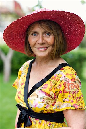 simsearch:6102-07769055,k - Portrait of a woman in a garden, Sweden. Stock Photo - Premium Royalty-Free, Code: 6102-03828075