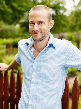 A man leaning against a fence, Sweden. Stock Photo - Premium Royalty-Free, Code: 6102-03828341