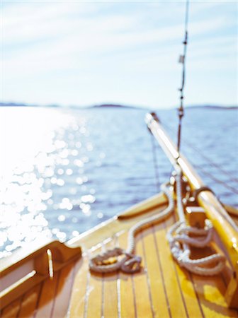 sparkly water - The stem of a tree boat out at sea, Sweden. Stock Photo - Premium Royalty-Free, Code: 6102-03828407