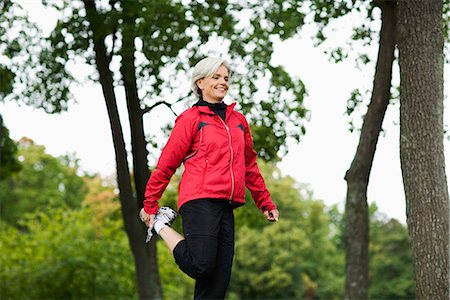 simsearch:633-06354678,k - A woman doing stretching exercises, Stockholm, Sweden. Stock Photo - Premium Royalty-Free, Code: 6102-03828590