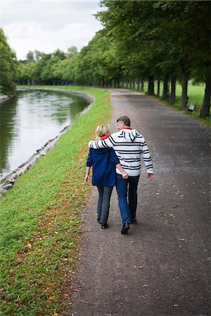 A tender couple strolling in the park, Sweden. Stock Photo - Premium Royalty-Free, Code: 6102-03828523