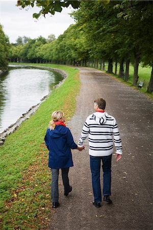 A tender couple strolling in the park, Sweden. Stock Photo - Premium Royalty-Free, Code: 6102-03828521