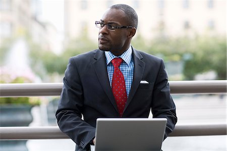 A businessman using a laptop, Stockholm, Sweden. Stock Photo - Premium Royalty-Free, Code: 6102-03828699