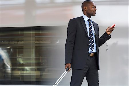 Businessman talking in a mobile phone, Stockholm, Sweden. Stock Photo - Premium Royalty-Free, Code: 6102-03828625