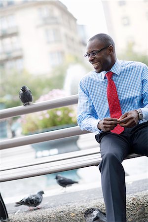 pigeon - A man sitting on a bench, Stockholm, Sweden. Stock Photo - Premium Royalty-Free, Code: 6102-03828709