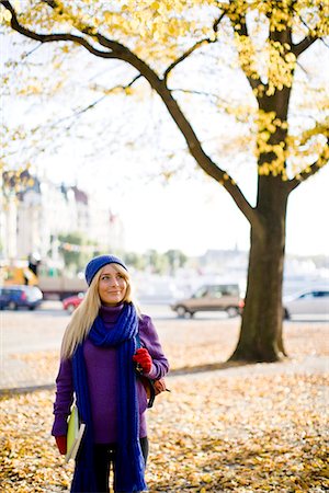 Young female student taking a walk in autumn, Stockholm, Sweden. Stock Photo - Premium Royalty-Free, Code: 6102-03828967