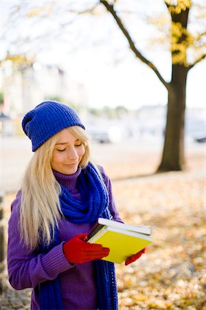 student walking not backpack not elementary not campus not indoors - A female student in autumn, Sweden. Stock Photo - Premium Royalty-Free, Code: 6102-03828969