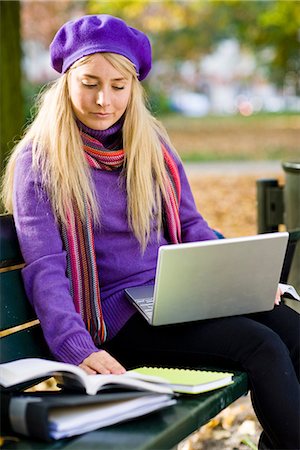 simsearch:6102-03828834,k - A woman sitting on bench in a park using a laptop, Stockholm, Sweden. Stock Photo - Premium Royalty-Free, Code: 6102-03828987