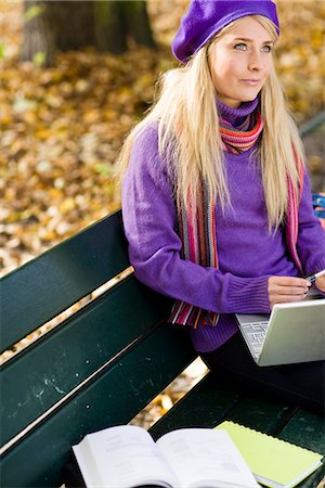 simsearch:6102-03828834,k - A woman sitting on bench in a park using a laptop, Stockholm, Sweden. Stock Photo - Premium Royalty-Free, Code: 6102-03828986